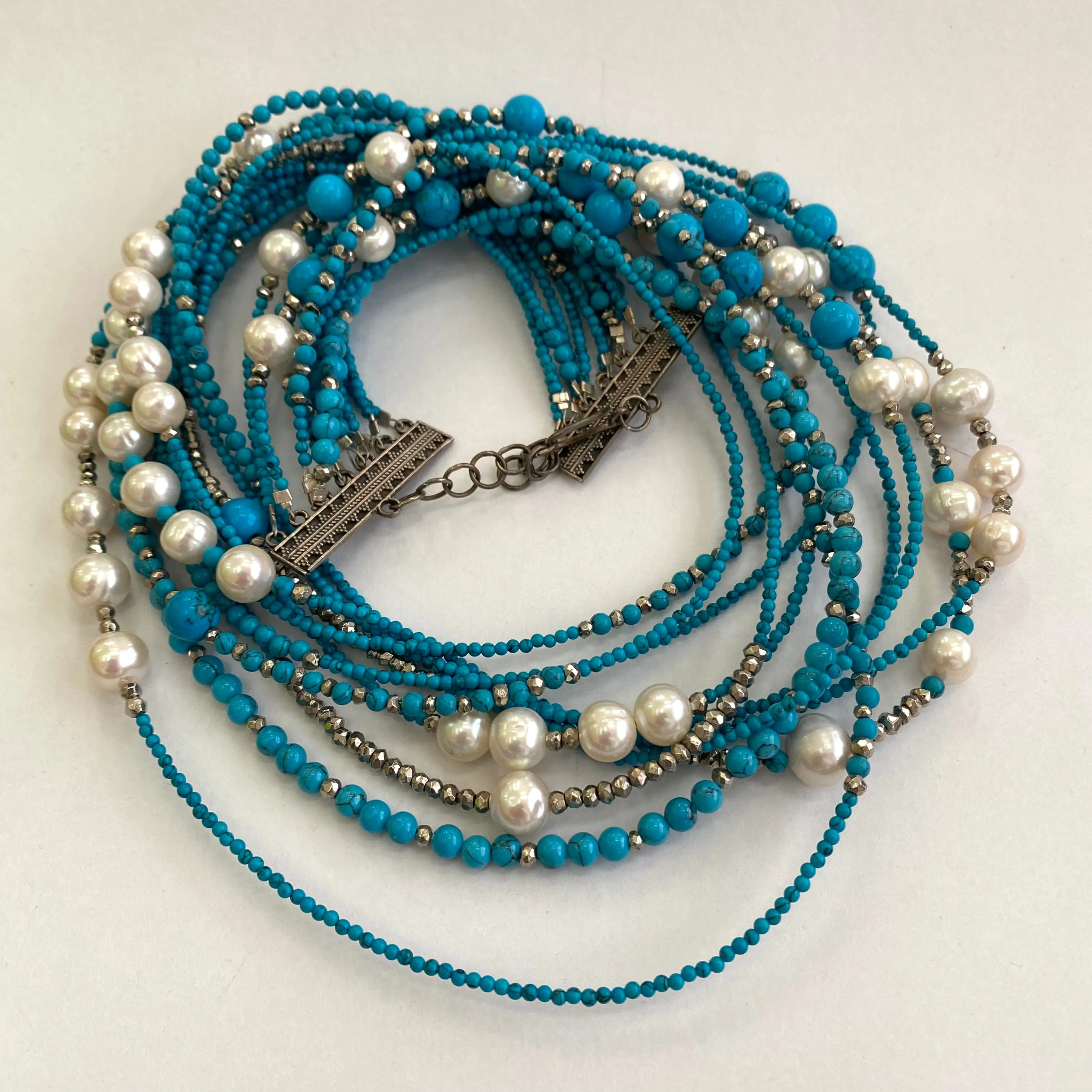 11 Strands Turquoise Necklace with Fresh Water pearls and Silver Coated Pyrite Beads